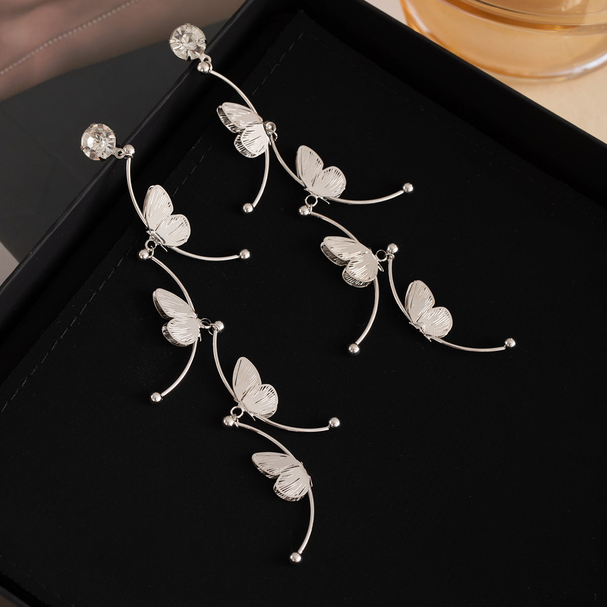 Long Tassel Stud Earrings with Hollow Silver Butterfly & Diamond Inlay (TE18)