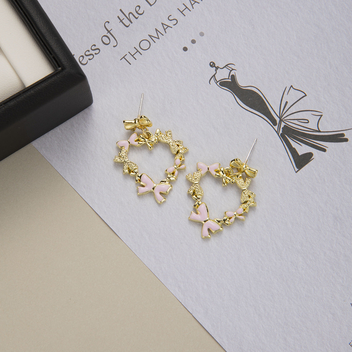 High-End Hollow Heart Bow Alloy Stud Earrings with Silver Plated Needles (TE04)